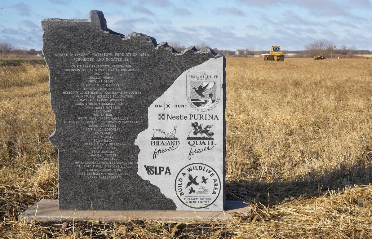 Earthmoving equipment moves past the granite monument at the recently dedicated Howard K. Vincent Waterfowl Production Area near Spirit Lake, Iowa. Photo by Dave Schwarz, Pheasants Forever Minnesota Outreach Coordinator HKV Update 2